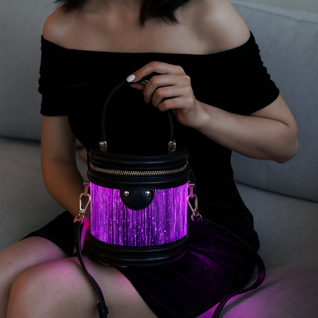 Model seated with the glowing Haske Halo Bag
